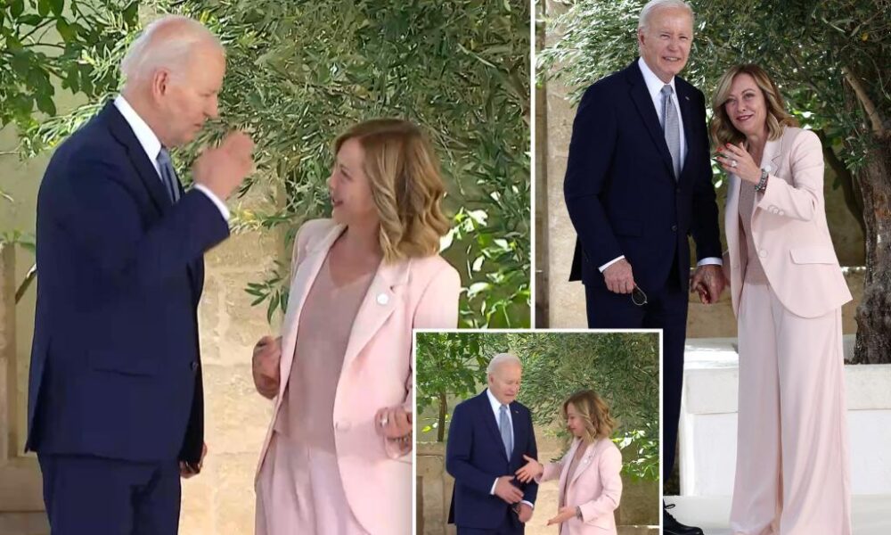 Biden awkwardly salutes Italian Prime Minister Giorgia Meloni as he arrives at G7 Summit