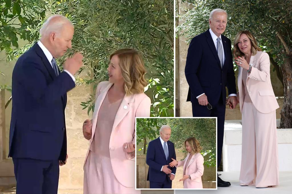 Biden awkwardly salutes Italian Prime Minister Giorgia Meloni as he arrives at G7 Summit