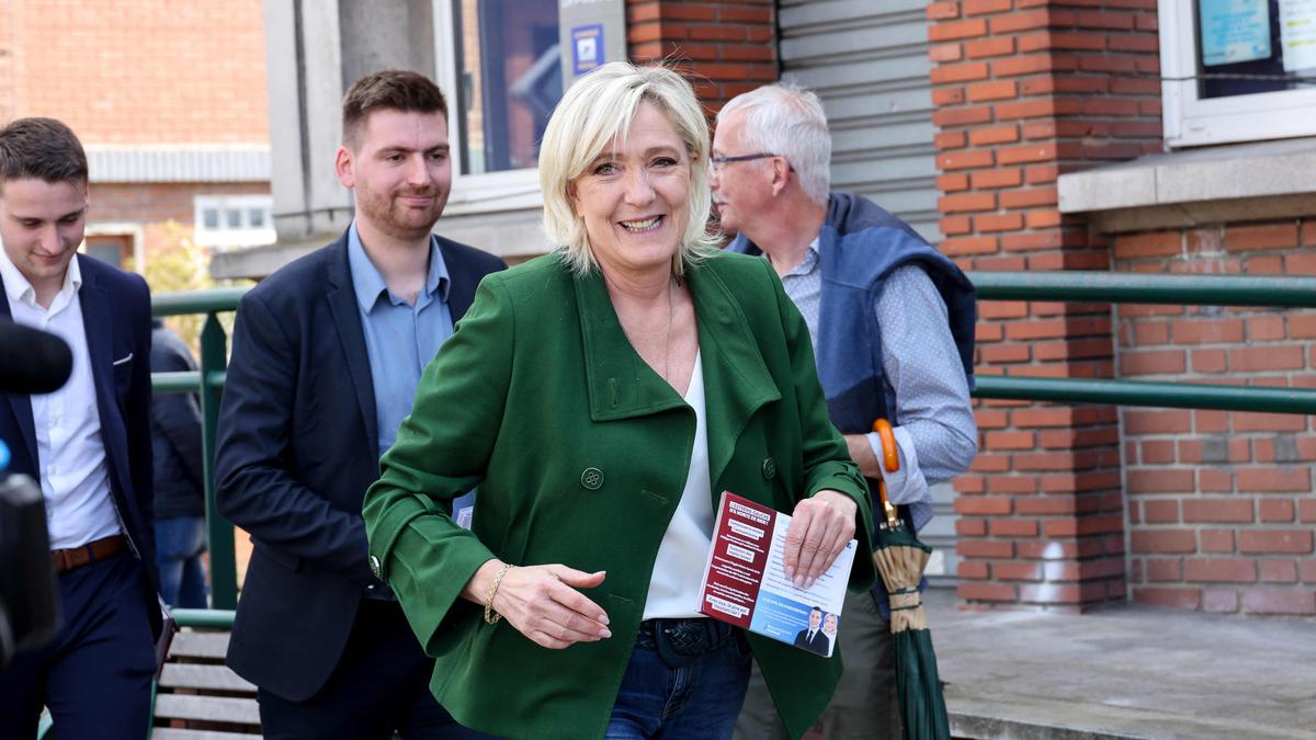 France's far right National Rally still leading ahead of election, poll shows