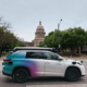 Zoox Toyota Highlander autonomous vehicle side view on street in Austin, Texas