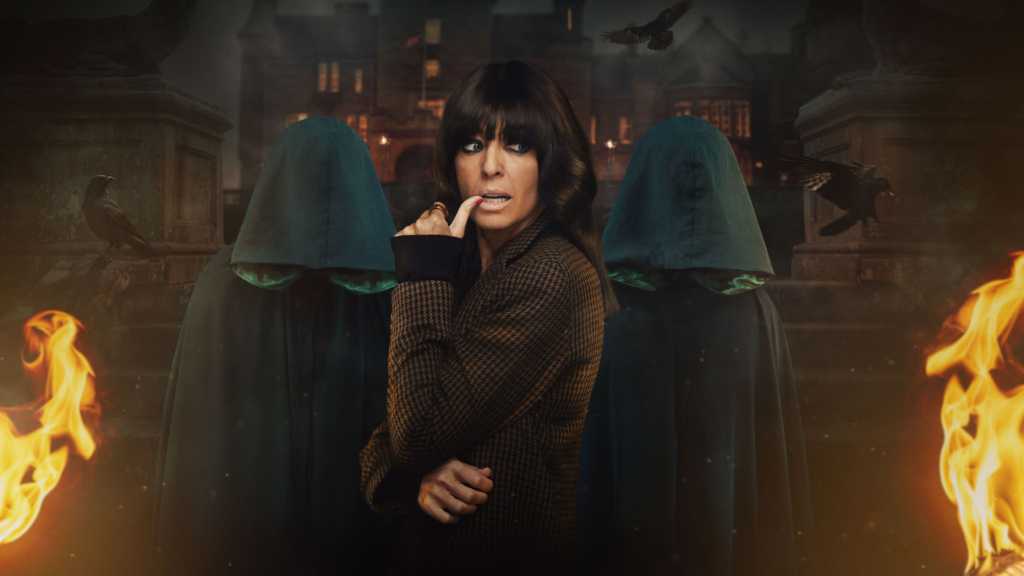 Claudia Winkleman and two Traitors in cloaks