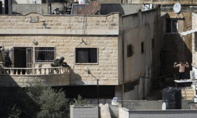 Israeli soldiers pushed three apparently lifeless bodies from roofs during a West Bank raid