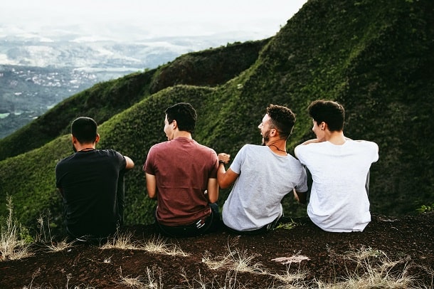 Friends watching a mountain view and having fun.