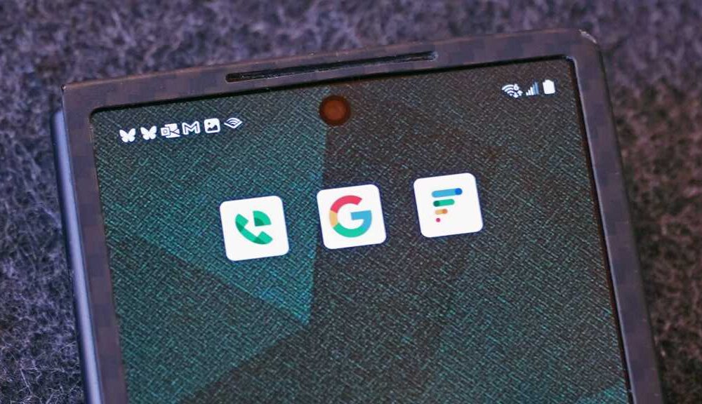 android phone with app logos Google, Google Voice, Google Fi