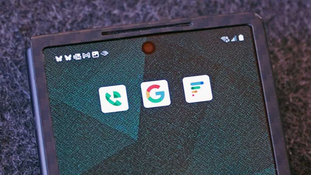 android phone with app logos Google, Google Voice, Google Fi