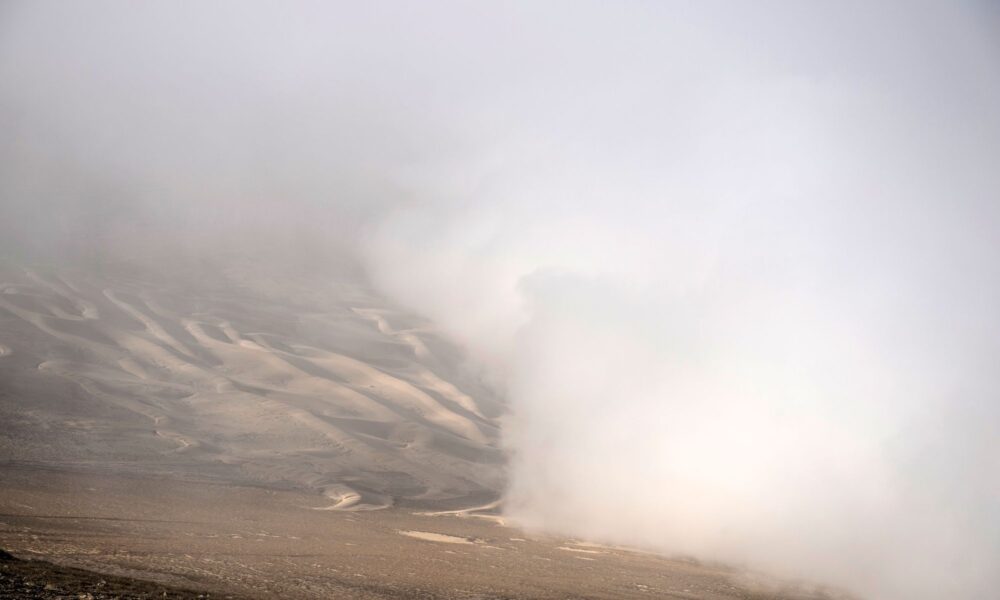 View of fog at the Atacama desert in Iquique, some 2000 km north of Santiago, on April 19, 2016. Catholic University of Chile researchers' challenge is to implement a fog collection system -which uses large pieces of vertical canvas to make the fog condense into droplets- in small communities which don't have drinkable water in Atacama desert. / AFP / MARTIN BERNETTI (Photo credit should read MARTIN BERNETTI/AFP via Getty Images)