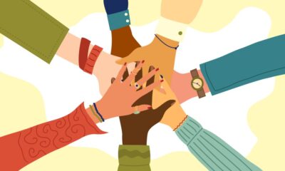 Hands of diverse group of people putting together. Concept of teamwork, cooperation, unity, togetherness, partnership, agreement, social community or movement. Flat style. Vector illustration.