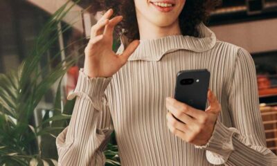 A woman holding the Google Pixel 9a