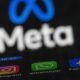 The apps Instagram, Facebook and WhatsApp can be seen on the display of a smartphone in front of the logo of the Meta internet company.