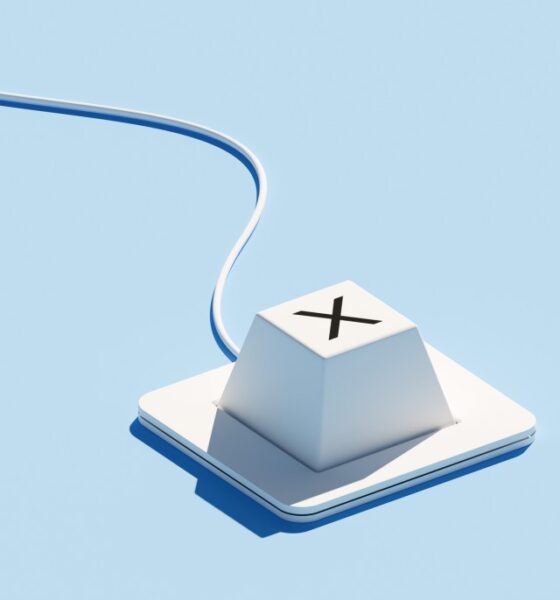 A keyboard with a single key featuring an "X" icon is set against a blue background. The "X" symbol typically represents rejection, cancellation, or incorrect choices, emphasizing decision-making processes. The minimalist design of the keyboard, combined with the vibrant blue backdrop, creates a modern look that highlights themes of selection and error management.